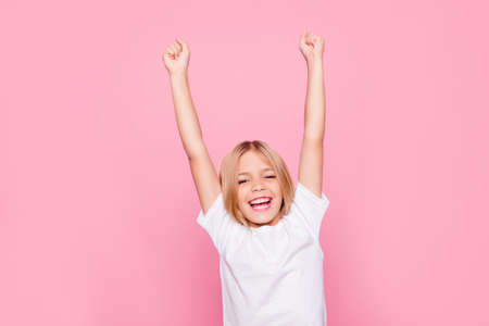 Holiday weekend event fortune luck delight rejoice people lifestyle leisure concept. Portrait of charming cheerful emotional excited joyful girl raising hands up isolated on gray backgroundの写真素材