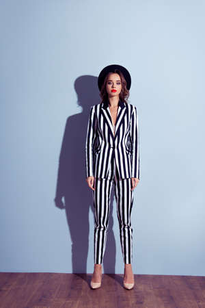 Full-length front view portrait of chic classy beautiful attractive pretty vintage retro style well-dressed good-looking woman staying straight isolated on gray background copy-spaceの写真素材