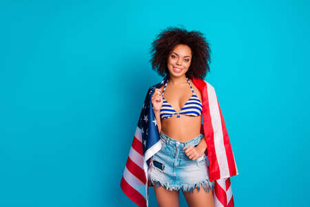 Portrait of attractive young cheerful confident calm peaceful african woman with curly hairdo...
