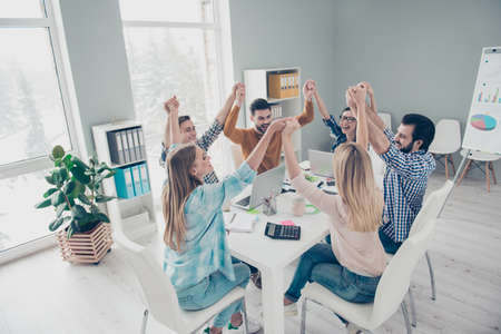 Confident, stylish, executive, attractive lucky colleagues sittin in modern office with interior...