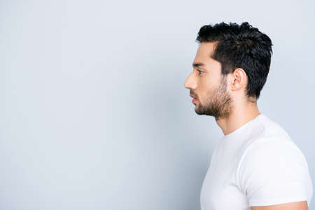 Profile side view portrait with copy space empty place for product of virile harsh macho in white outfit isolated on grey background wellness wellbeing daily care grooming conceptの写真素材