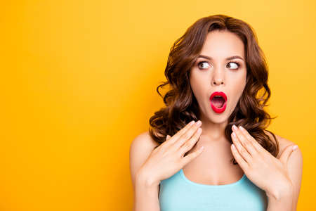 Portrait with copy space for advertisement of shocked afraid woman looking with eyes at empty place...