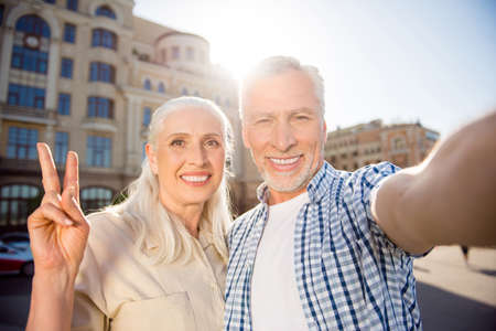 Hi! Rest relax leisure concept. Self portrait of friendly peaceful grandma and granddad shooting...