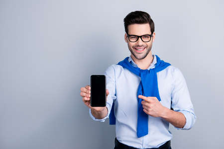 Portrait with copy space of attractive man with blue pullover tied around the neck recommend doing...