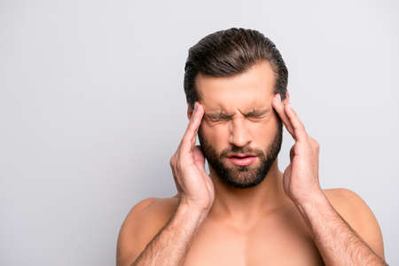 Close up portrait of sad unhappy upset stressed grimacing bearded topless torso man feeling...