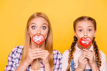 Older different age little people small teen teenager beauty concept. Close up portrait of two funny funky cute glad nice amazed excited kids covering lips heart sent kiss isolated bright backgroundの写真素材