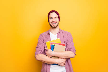 Portrait of excited confident cheerful joyful handsome clever intelligent a-student with toothy...