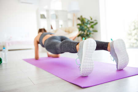 Aerobics gymnastics vitality active stylish life crossfit coach home gym weightloss concept. Rear...
