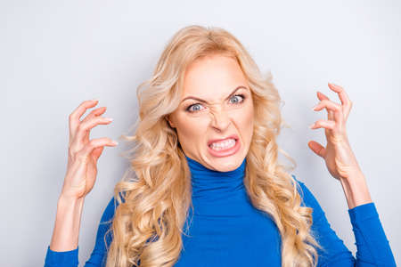 Portrait of sexy, stylish, pretty, cute, charming, nice, angry, nervous, blonde woman in blue roll...