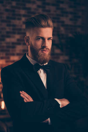 Employment ceremony tuxedo stylish concept. Vertical portrait of handsome attractive stunning young confident serious strict guy standing with crossed arms wearing black blazer white shirtの写真素材