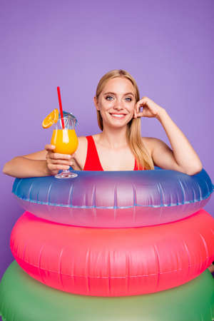 Concept of a safe and bright summer season on the beach. Close up portrait of blonde girl with...