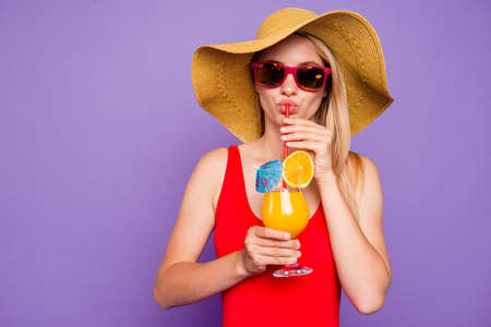 People person having rest relax leisure pause from work concept. Closeup photo studio shooting portrait of attractive lady tasting yummy cocktail from glass isolated bright backgroundの写真素材