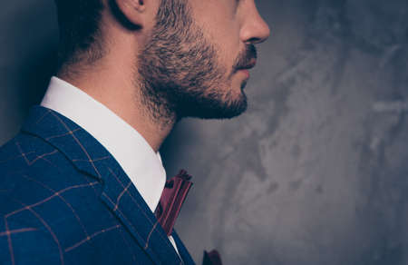 Classy clothing apparel tailor bridegroom fiance handsome attractive look concept. Close up photo portrait of nice strict gentleman looking aside isolated on  dark grey backgroundの写真素材