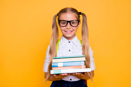 Schoolkid elementary academic season year information concept. Close up photo portrait of cute sweet lovely charming girl with notebook diary copybook isolated bright vivid backgroundの写真素材