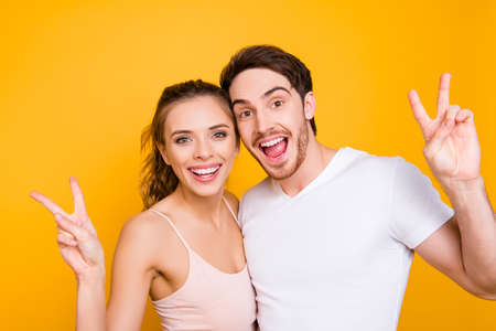 Portrait of cheerful positive students with beaming smiles gestuの写真素材