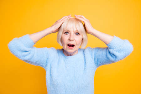 Close up portrait of scared old woman frowning and gesturing emo
