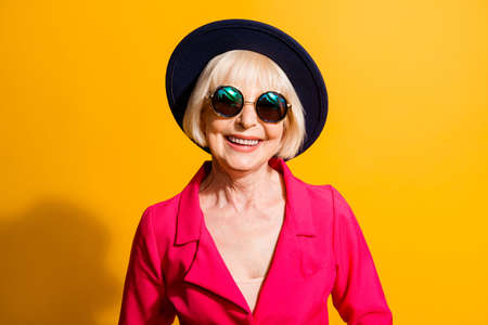 Close up portrait of beautiful and happy blond hair grandma look