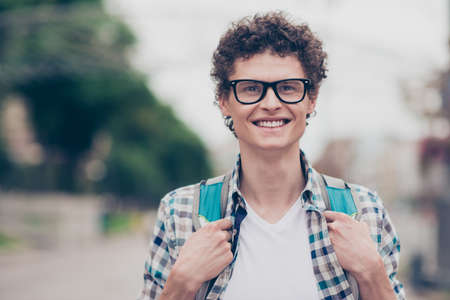 Portrait of curly haired cheerful cute attractive handsome smiliの写真素材