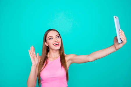 Portrait of young perfect straight-haired cheerful girl wearing