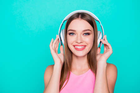 Portrait of young straight-haired cheerful smiling girl wearingの写真素材