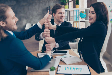 Three excited elegant classic business sharks, businesspeople in