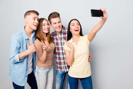 Portrait of cheerful fancy youngster stand isolated on light gra