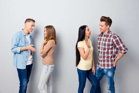 Four attractive nice young smiling friends, two girls and two gu