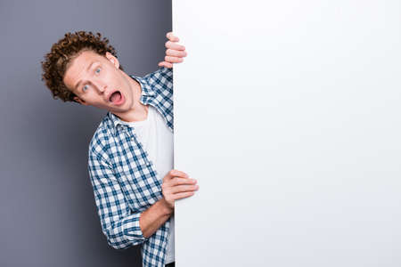 Stylish trendy nice handsome shocked funky positive young guyの写真素材