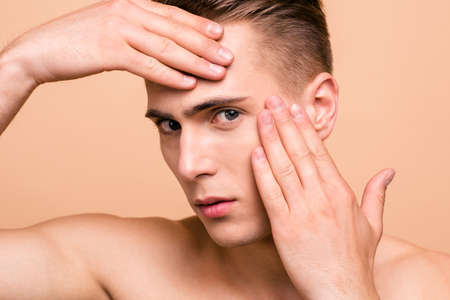 Close up portrait of sad, upset, frustrated, disappointed, naked manの写真素材