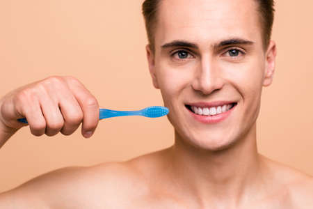 Close up cropped photo of happy, handsome, attractive man with bの写真素材