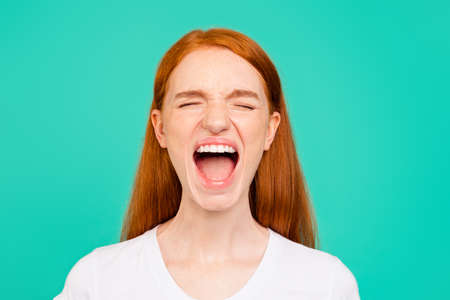 Portrait of crazy, expression, emotion girl closed eyes and openの写真素材