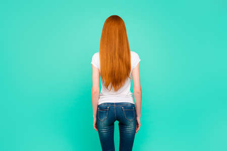 Back rear view of lady with long hair, wear in denim outfit clotの写真素材