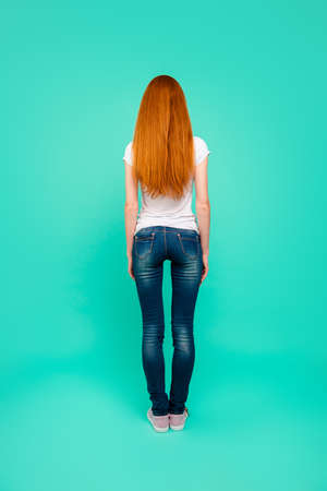 Full length, legs, body, size vertical back rear portrait of girの写真素材
