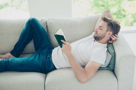 Profile side view photo of attractive, bearded, good-looking man