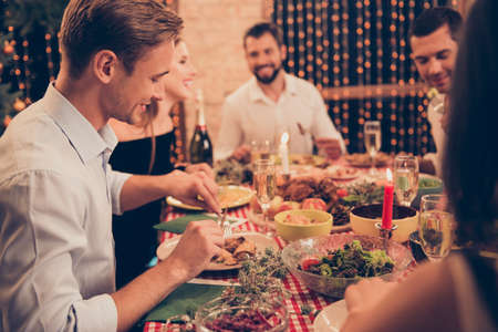 Beautiful stylish trendy classy elegant cheerful people sitting together for dinnerの写真素材