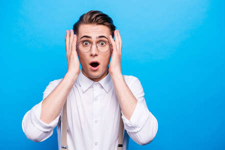 Portrait of good-looking youth man with wide open mouth and bigの写真素材