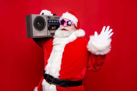 Carefree aged mature stylish Santa with white beard in costumeの写真素材