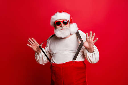 Portrait of cheerful positive dreamy funky Santa