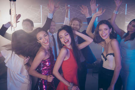 Lets dance all night Cheerful crowd with handsome man and lovel