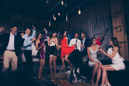 Low angle view of beautiful charming graceful vogue group of peopleの写真素材