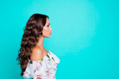 Profile side view photo of serious confident curly brunette womanの写真素材