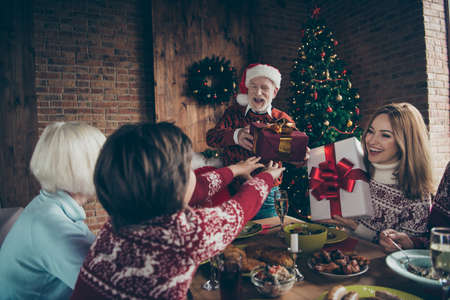 Noel gathering, meeting. Nice adorable cheerful familyの写真素材