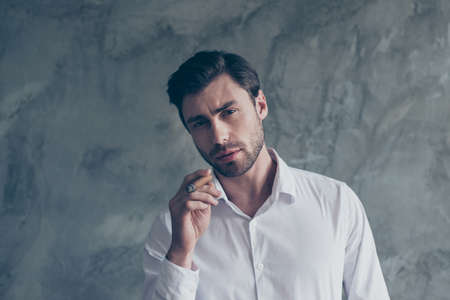 Leisure concept. Brunet gentleman look at camera stand in casualの写真素材