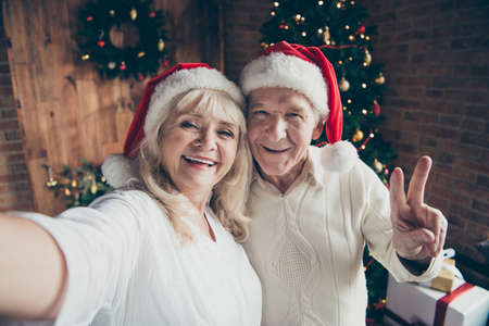 Self-portrait of two funny funky childish playful cheerful coupleの写真素材