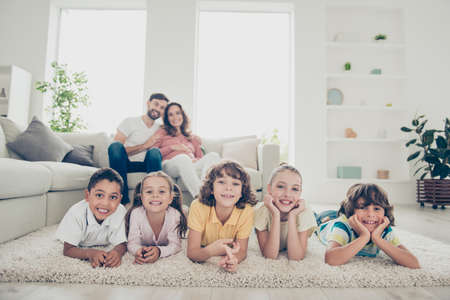 Close up of multinational twins kids look at cameraの写真素材