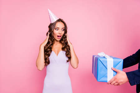 Cropped guys hands bring big white blue gift to amazedの写真素材