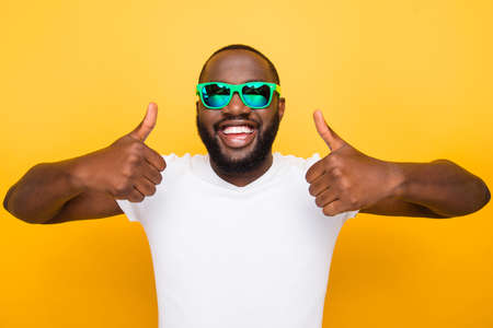 Portrait of cheerful nice glad satisfied mulatto man in color