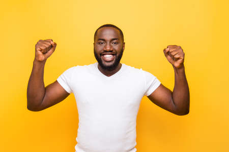 Portrait of cheerful excited delighted mulatto manの写真素材