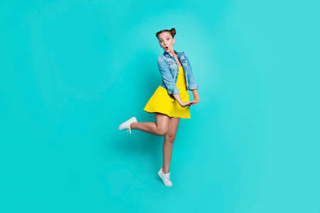 Portrait of girl posing with blue background.の写真素材