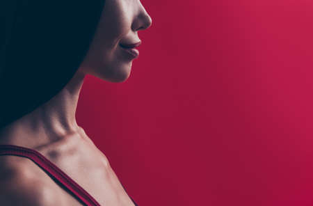 Close up cropped photo of face attractive person she isolated on red maroon pastel background with copy space for textの写真素材